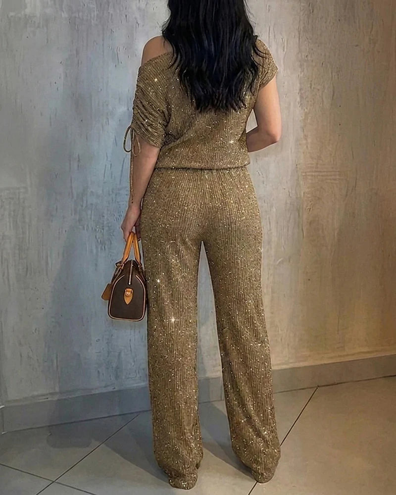 Damesæt med skinnende strik, off-shoulder top og vide ben